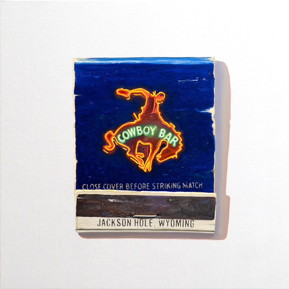 Pop art painting of a matchbook cover with neon cowboy sign from Jackson Hole’s Cowboy Bar, set against a bold blue backdrop.