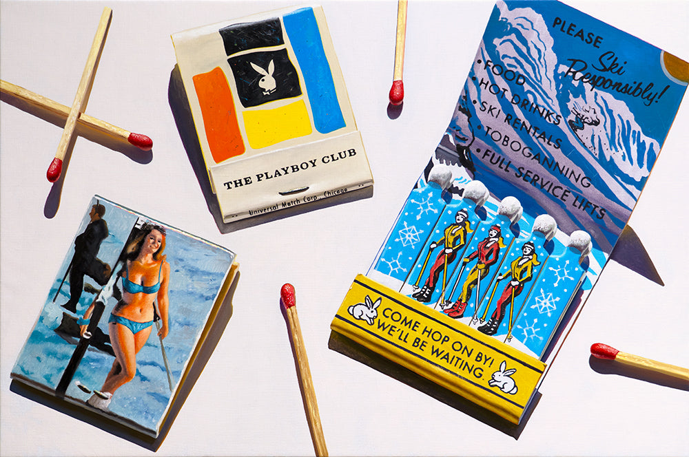 Vintage matchbooks with skiing and playboy imagery on a white background