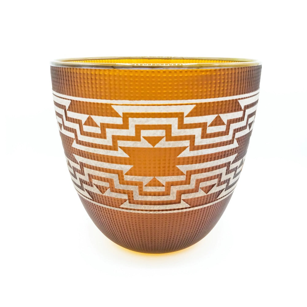 Cedar-toned blown glass basket by Preston Singletary featuring crisp white stepped geometric patterns inspired by Native weaving traditions.