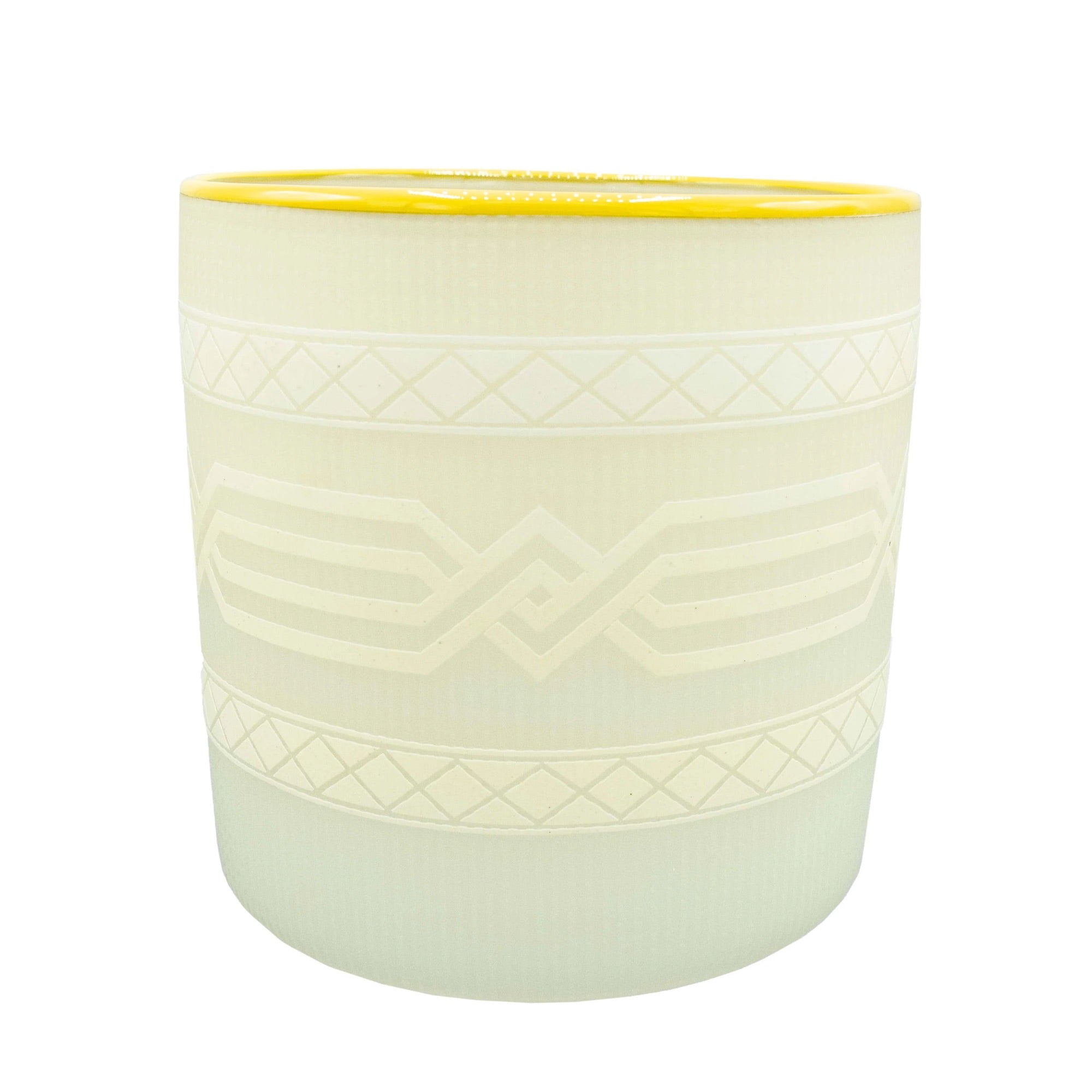 Cream-colored blown glass vessel by Preston Singletary with subtle etched patterns and a yellow rim, inspired by traditional Native basketry.